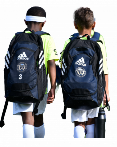 Children walking with soccer backpacks